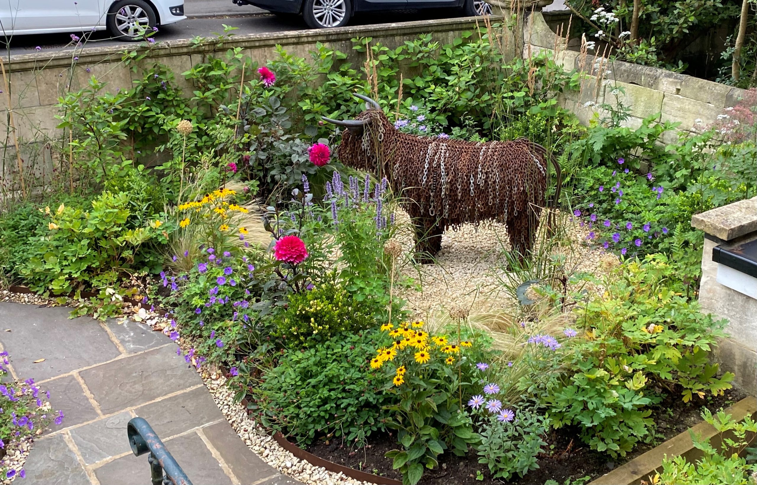 Soft landscaping with native wildflowers and mature trees in Wiltshire estate garden